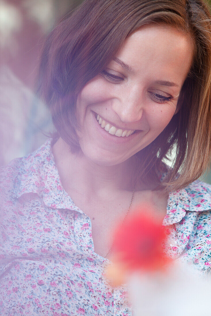 Mid adult woman laughing, Munich, Bavaria, Germany