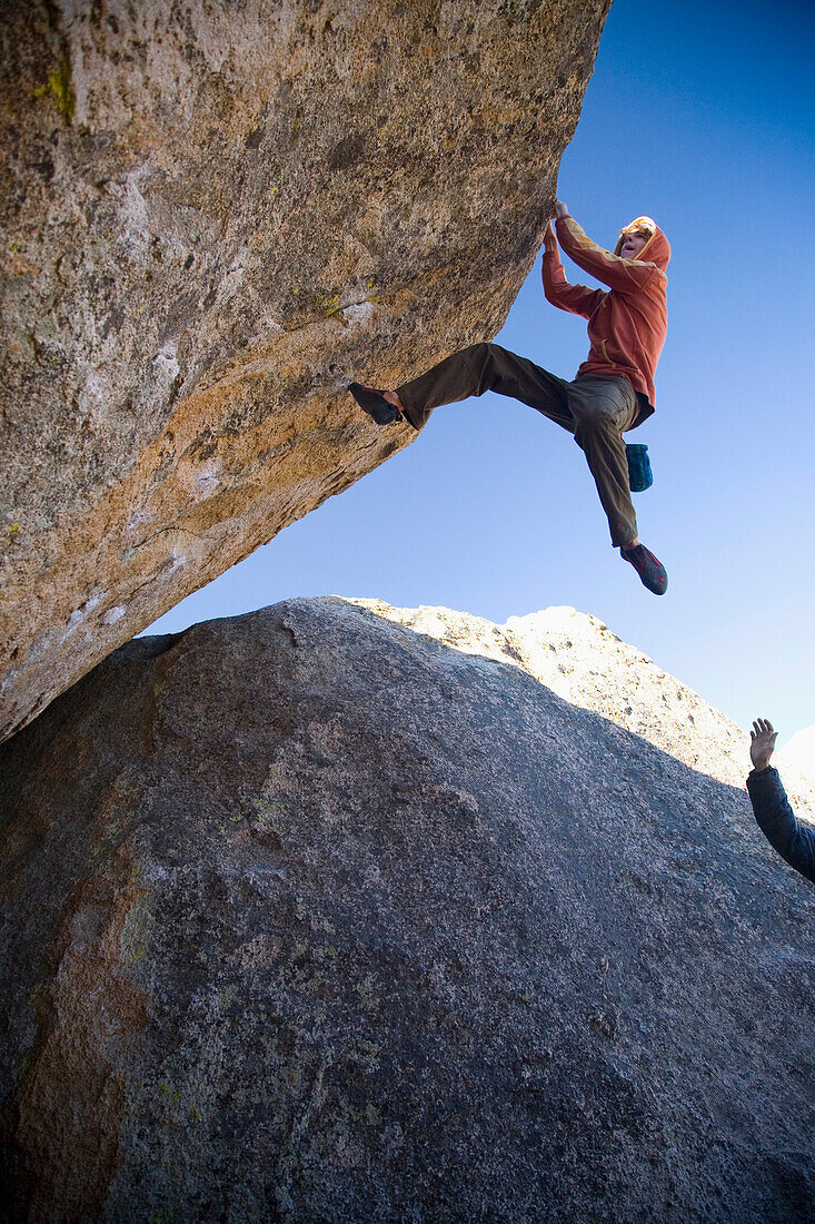 A man bouldering in the Buttermilks Bishop, California, USA