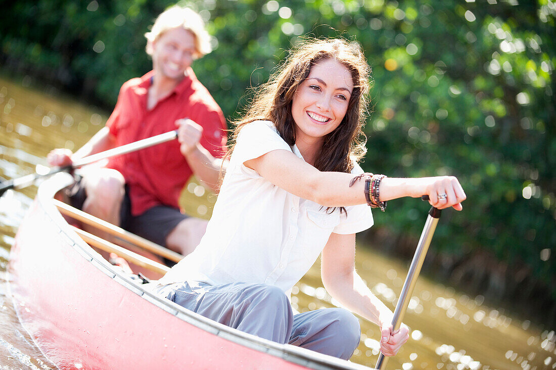 A couple paddles a canoe in Everglades National Park, Florida Florida, USA