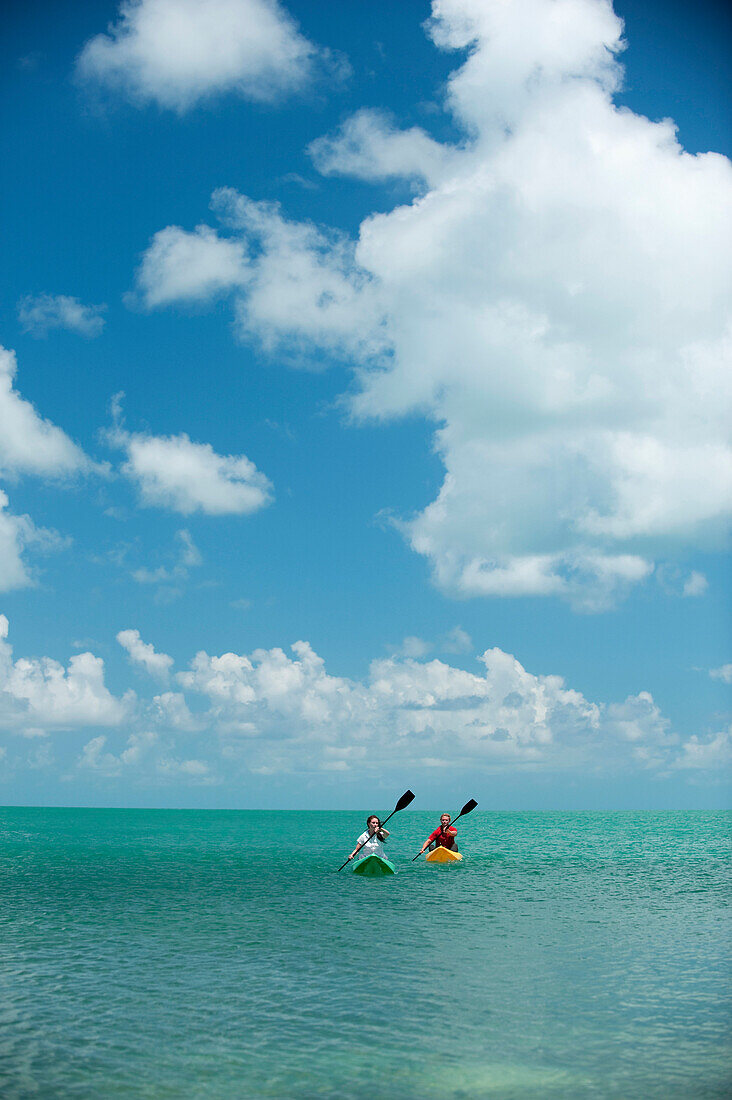 A man and woman kayak in Florida Key West, Florida, USA