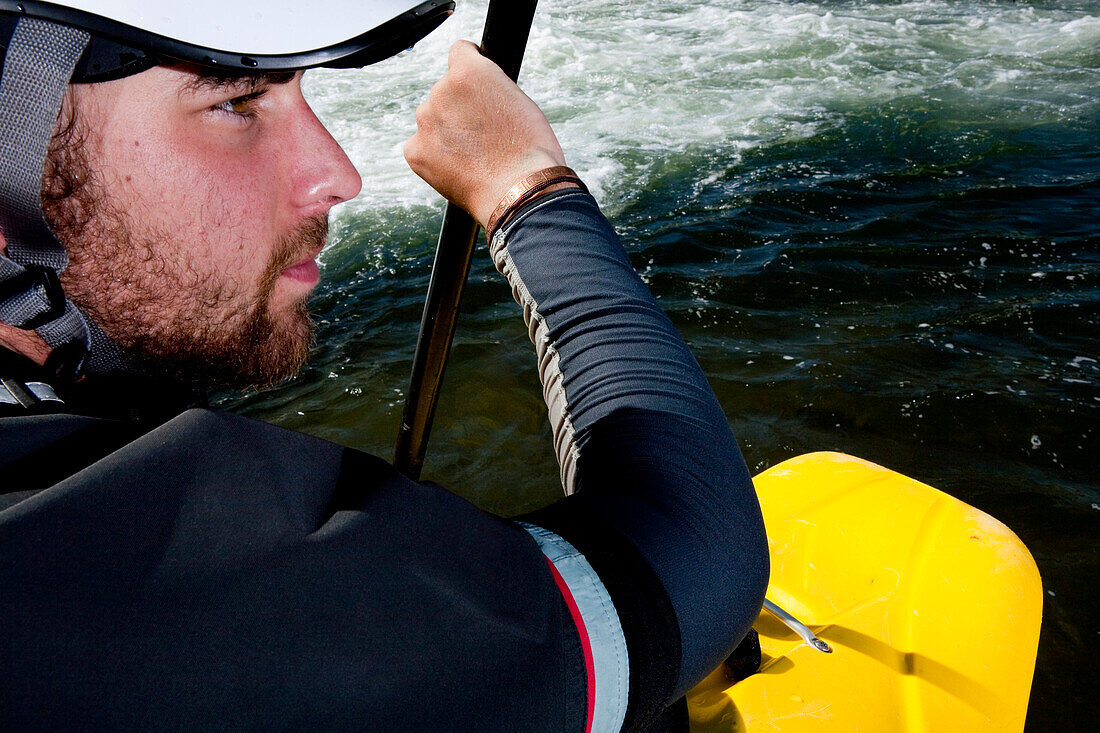 Close-up of a kayaker's face while paddling the Clark Fork River, Missoula, Montana Missoula, Montana, USA