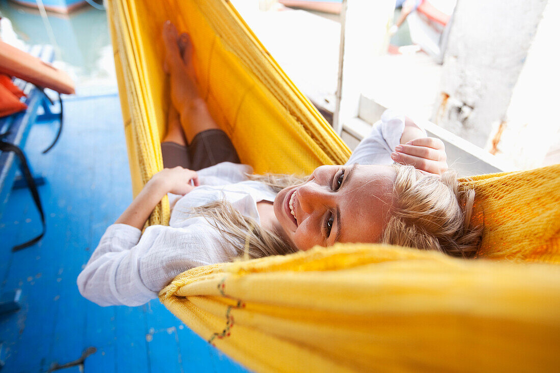 A woman relaxes in a hammock in Brazil Brazil