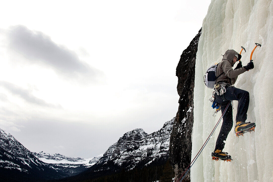 A man ice climbing Bozeman, Montana, USA