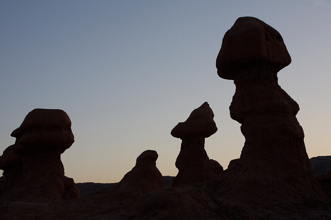Hoodoos are individual, small rock formations, silhouetting the sky in Goblin Valley State Park, Utah Utah, USA