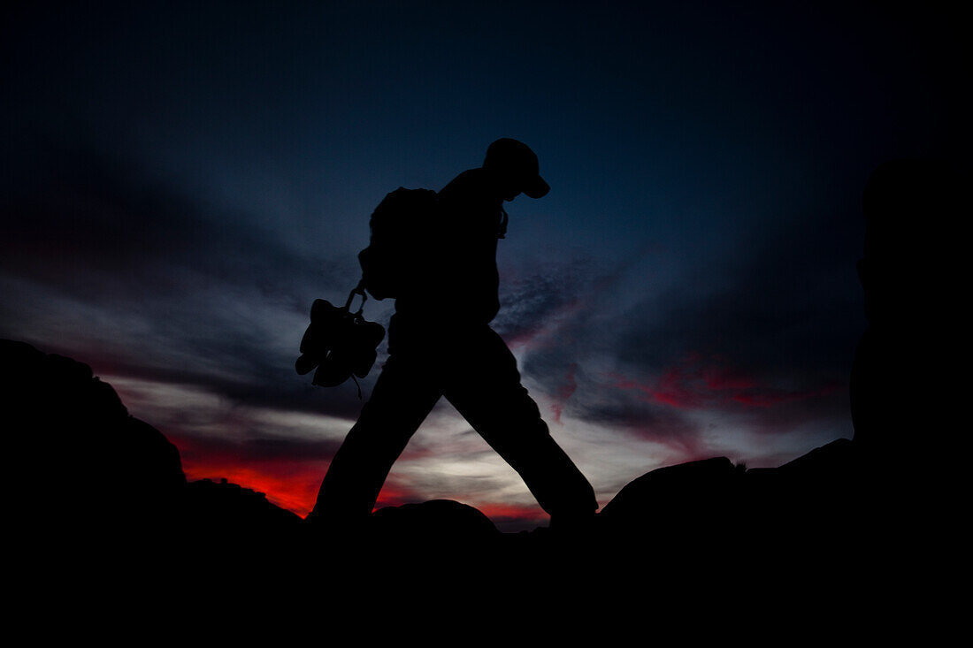 A man hikes in Joshua Tree, California Joshua Tree, California, United States of America