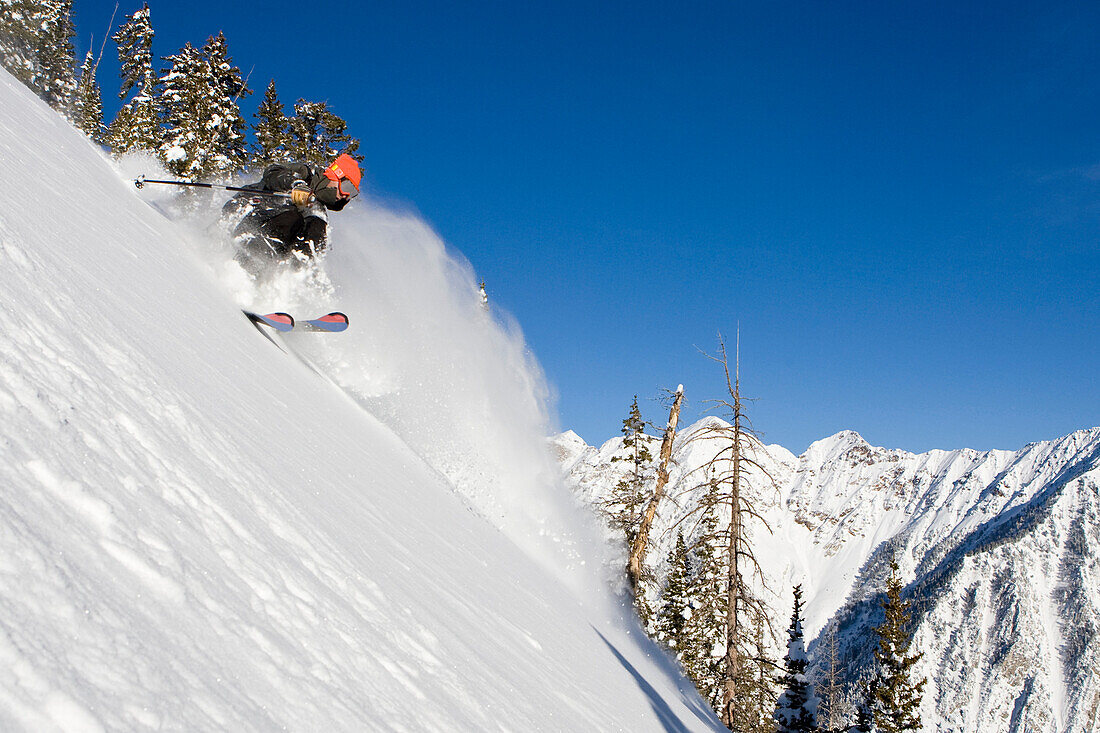 A man makes some steep powder turns in the Wasatch backcounty Utah, USA