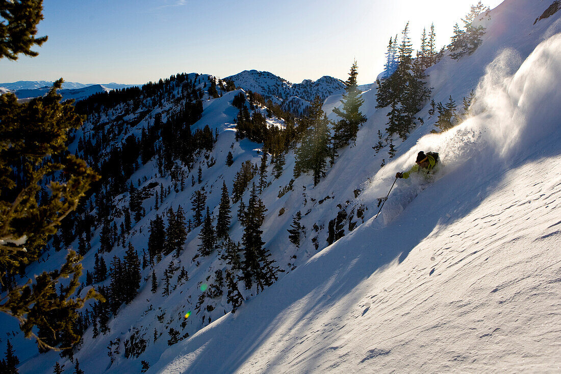 A man skiing powder in the early morning Utah light Utah, USA