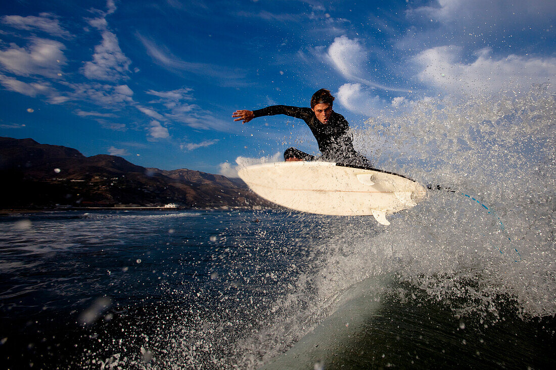 A skilled male surfer launches an air Malibu, California, United States of America
