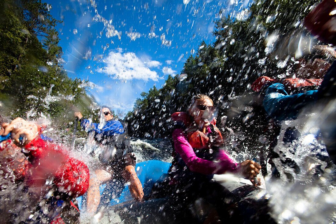 A group of adults whitewater rafting in Maine West Forks, Maine, United States of America