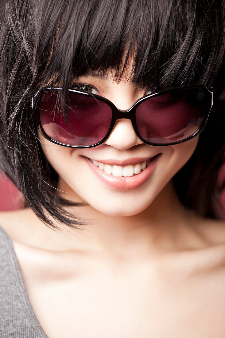Chinese woman wearing sunglasses, Seattle, WA, USA