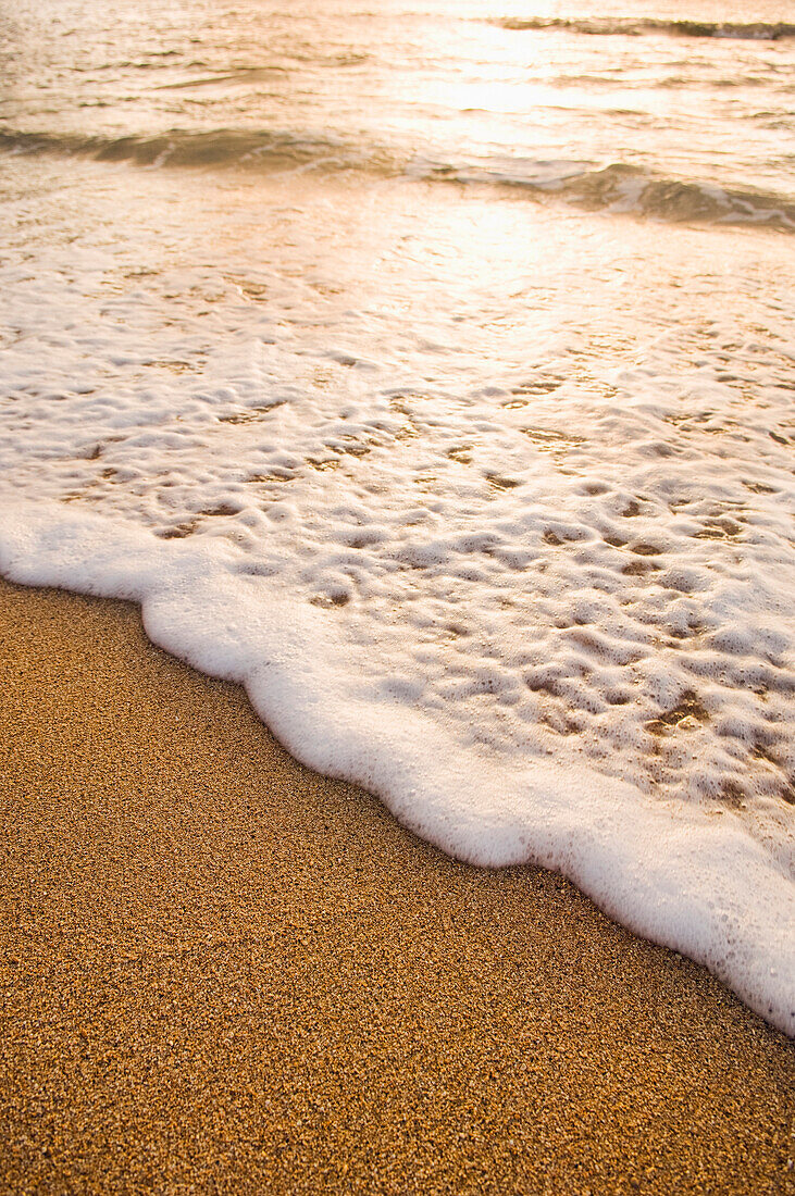 Foamy wave on beach, Island of Kauai, Hawaii, United States