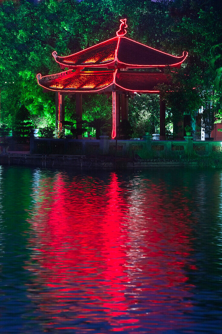 Colorful Vietnamese pagoda near water, Hanoi, Vietnam