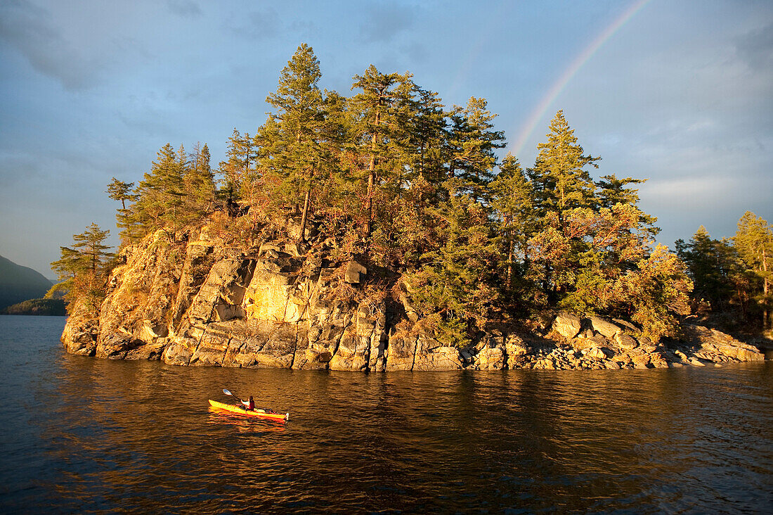 Hispanic woman kayaking on lake, Lund, British Columbia, Canada