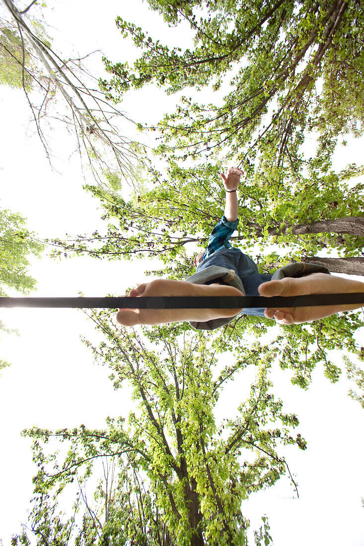 Caucasian man balancing on rope in park, Caldwell, Idaho, USA