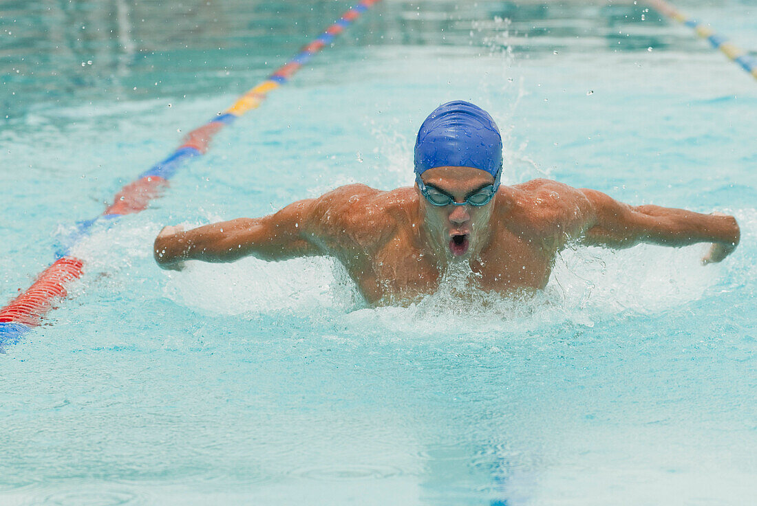 Hispanic man swimming in swimming pool, Caracas, Caracas, Venezuela