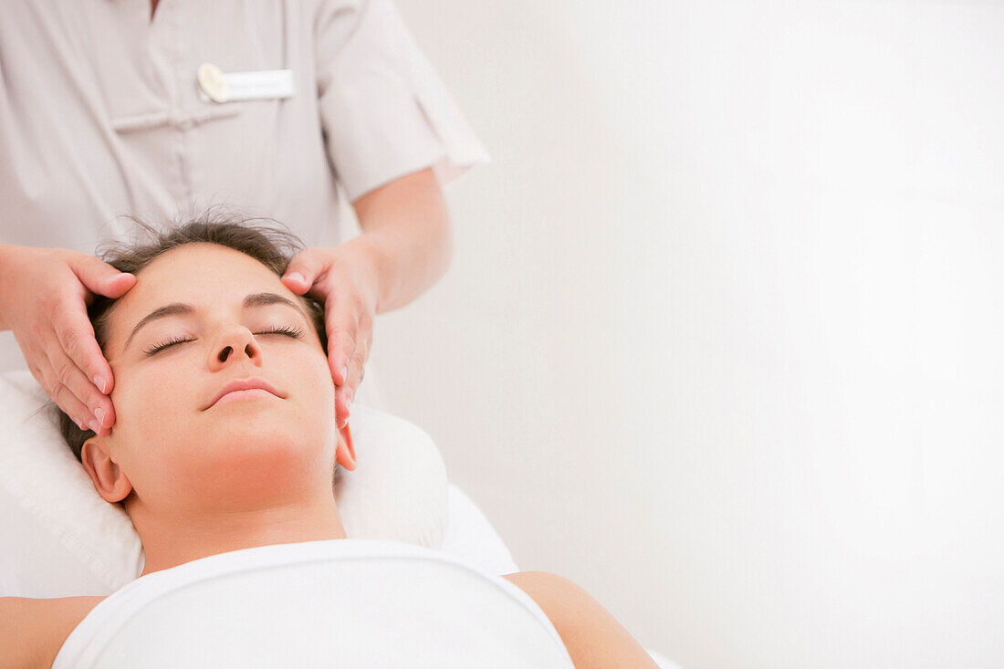 Woman having facial massage, Stowe, Vermont, USA