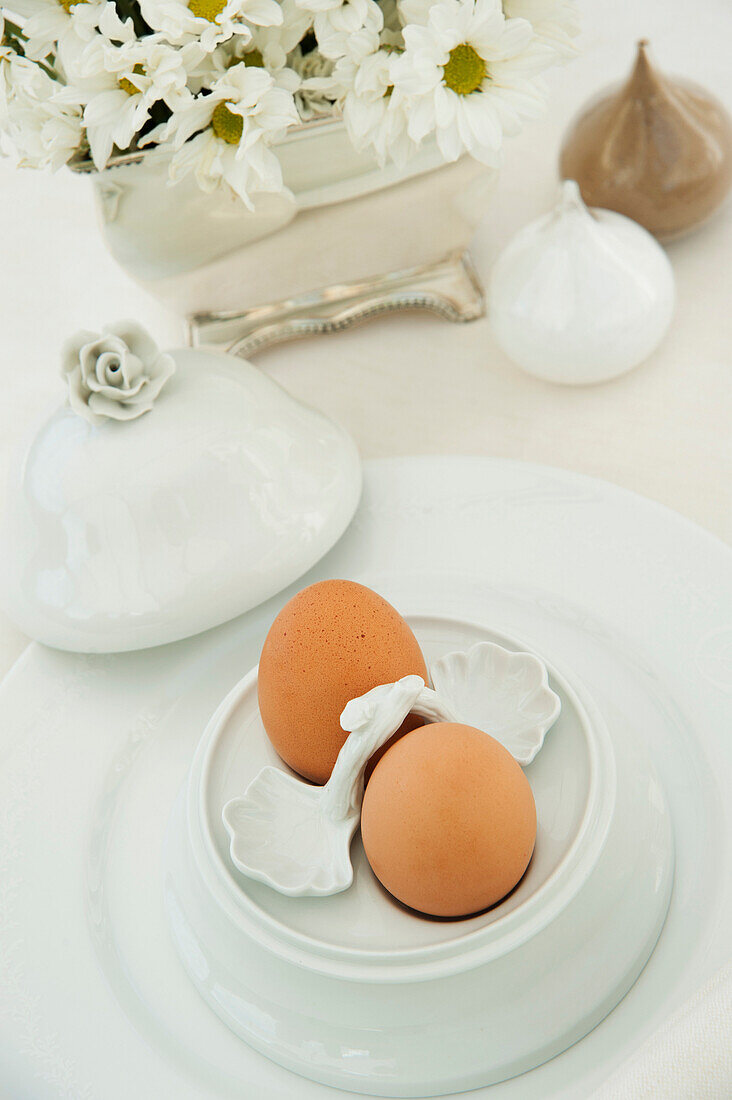 Two boiled eggs in an ornate egg cup, Alba, Cuneo, Italy