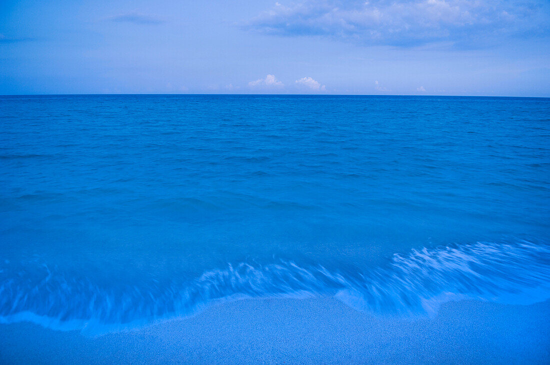 Waves on beach of tranquil blue ocean, Miami Beach, Florida, United States