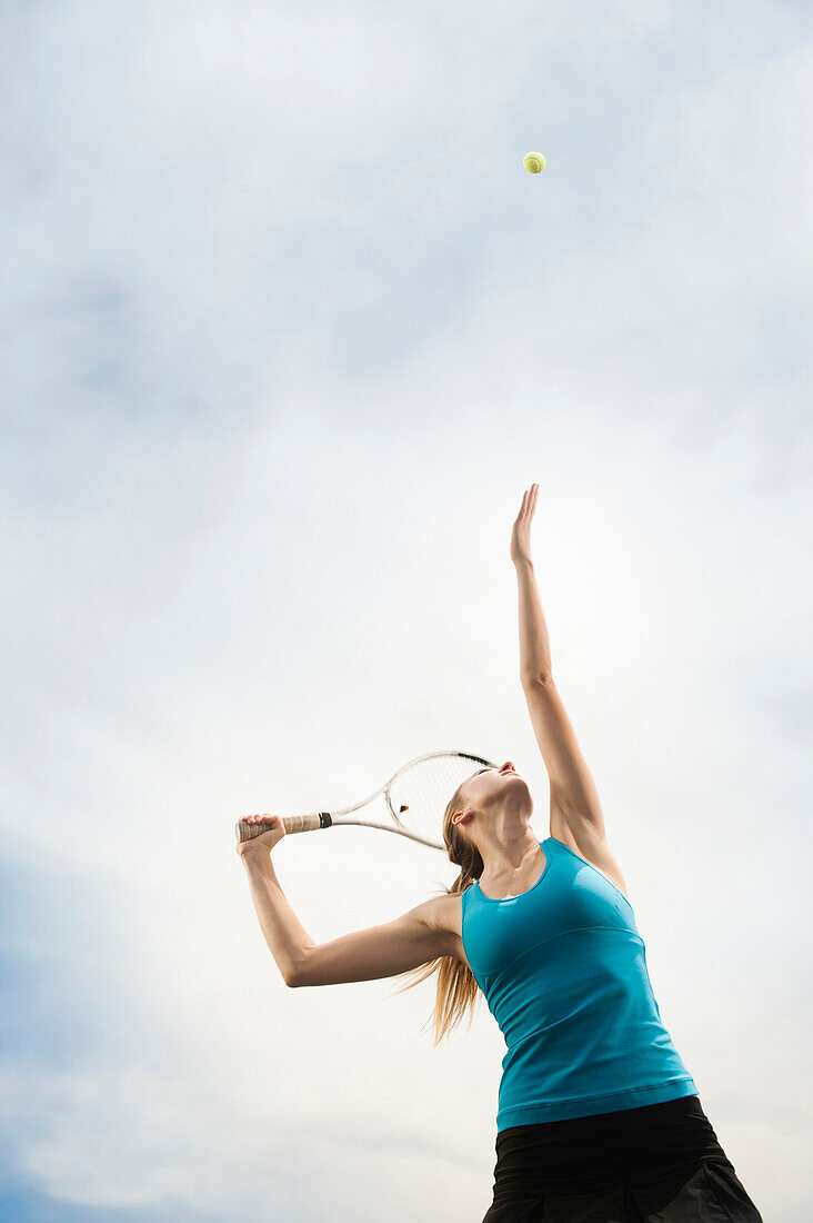 Caucasian woman playing tennis, Orem, Utah, United States