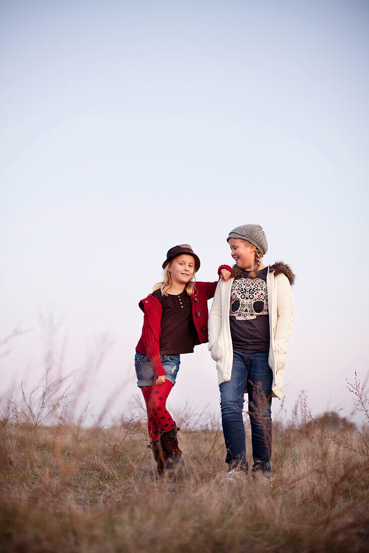 Caucasian girls standing in field, Sacramento, CA, USA