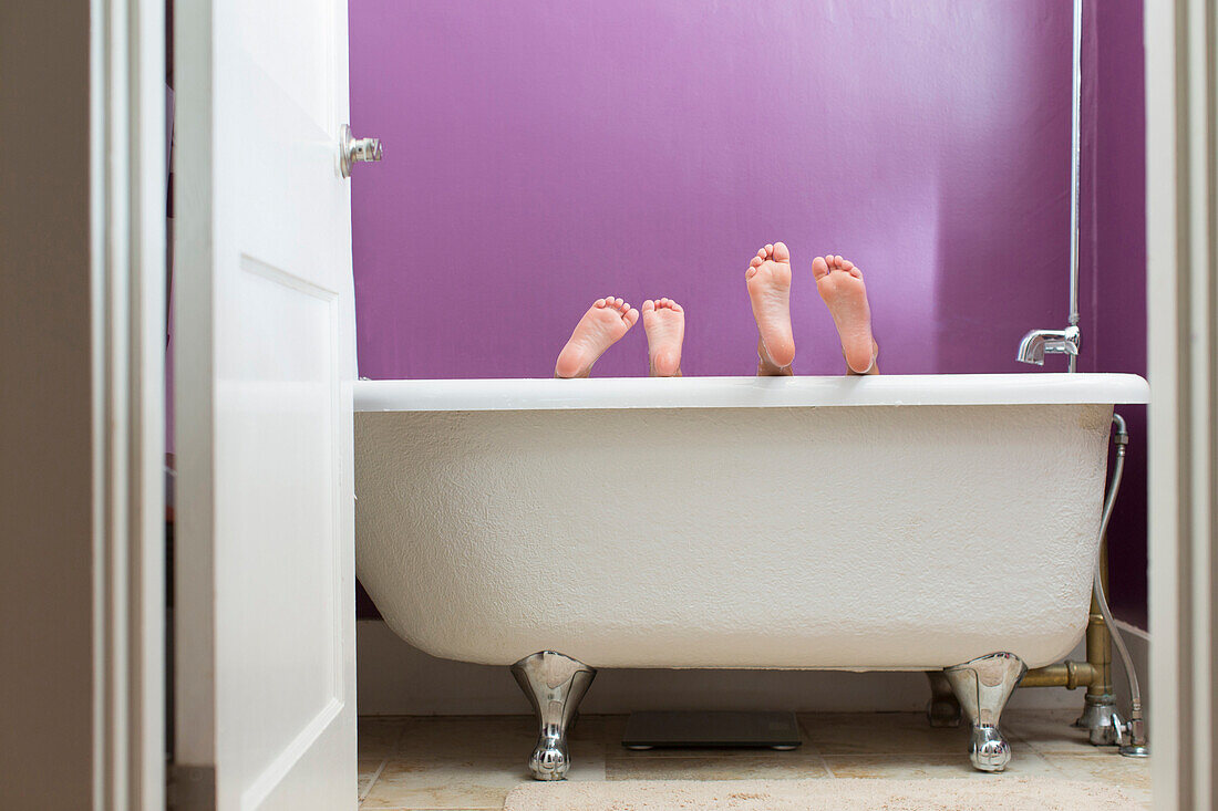 Mixed race girls playing in bathtub, Portland, OR, USA