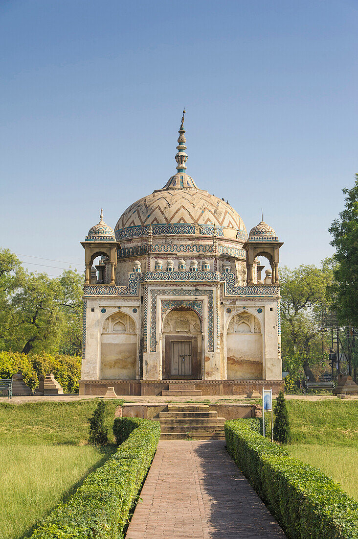 Ornate building with manicured lawn, Varanasi, Uttar Pradesh, India