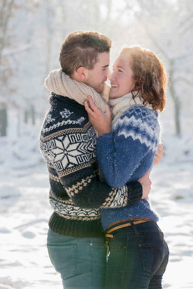 Caucasian couple hugging in snow, Nijmegen, Gelderland, Netherlands