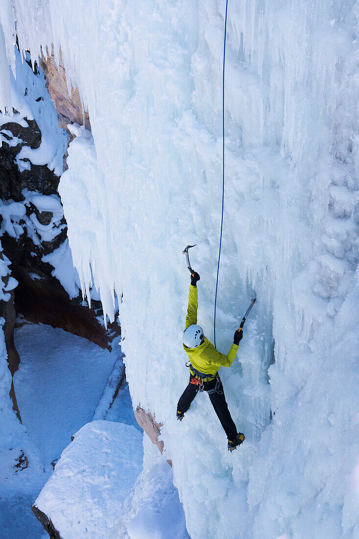 Caucasian climber scaling glacier, Ouray, CO, USA