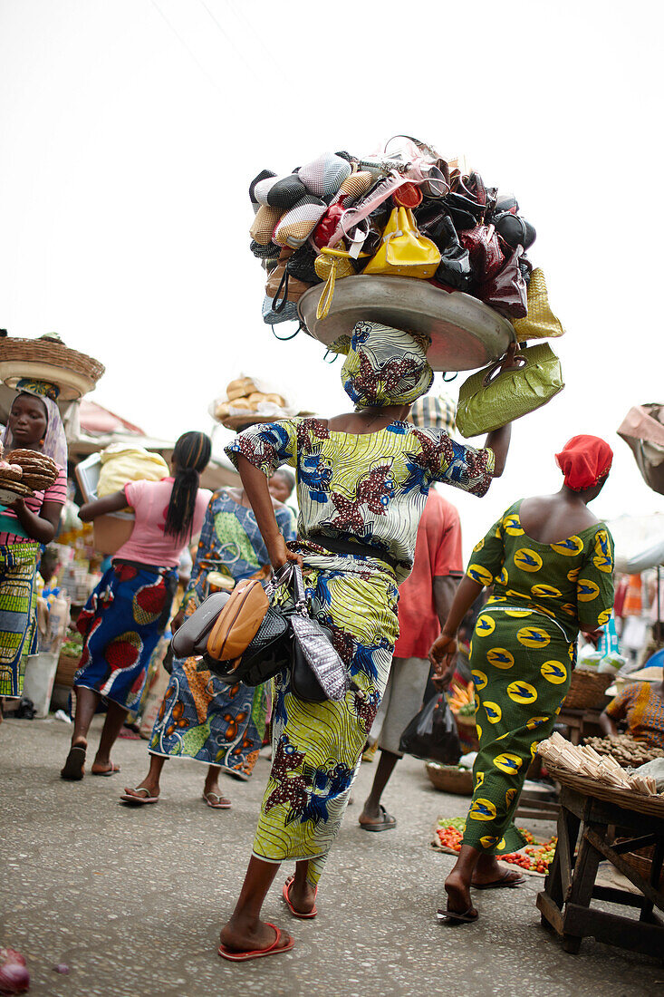 Woman selling handbags at Dantokpa market, Cotonou, Littoral Department, Benin