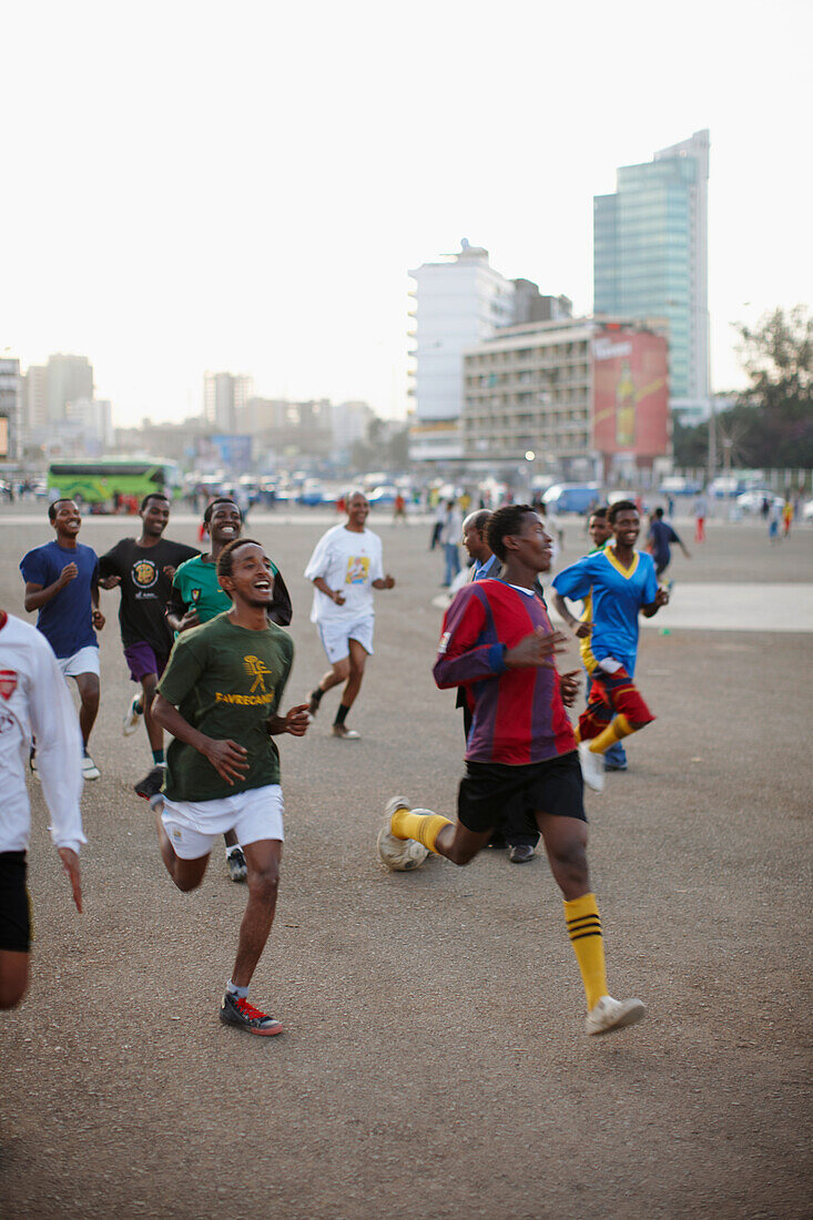 Football players at Masqal Square in the evening, Addis Ababa, Ethiopia