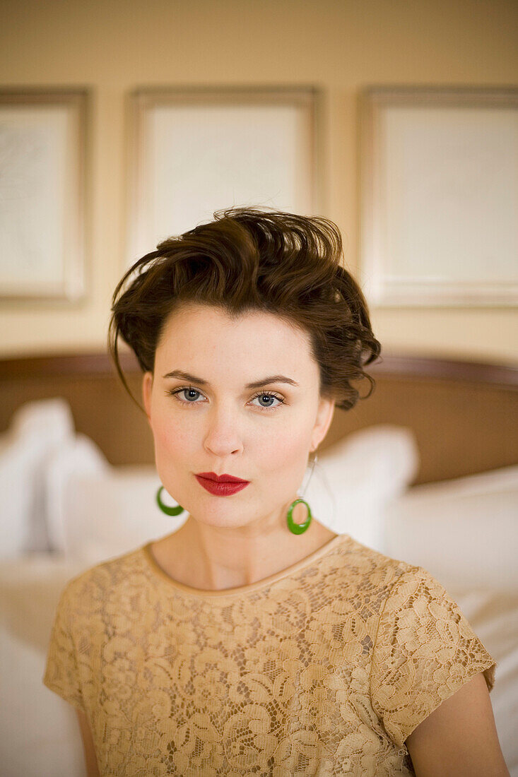 Close up of woman with hair up wearing red lipstick, Seattle, WA