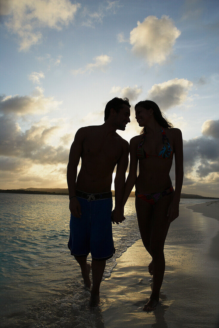 South American couple walking on beach, Morrocoy, Venezuela