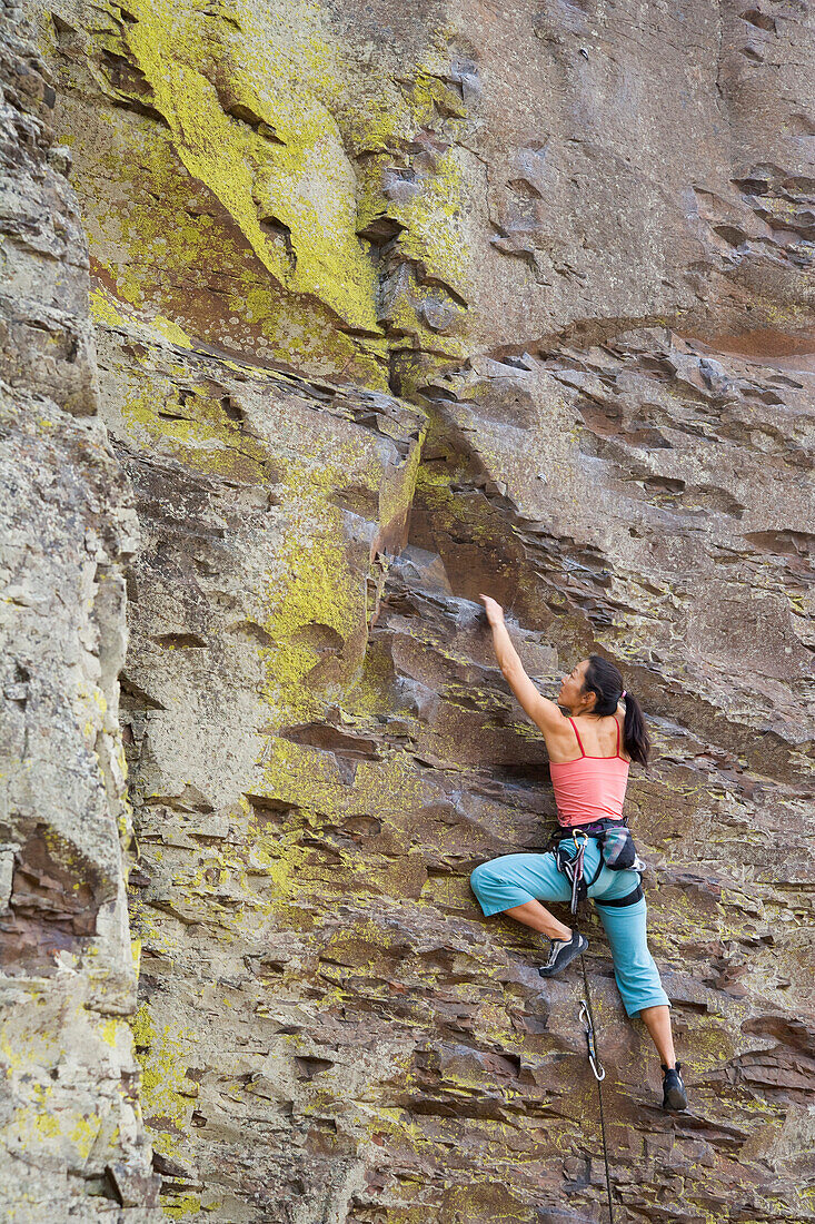 Asian woman rock climbing, Vantage, WA
