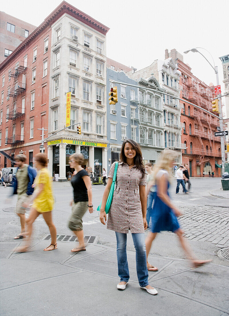 Mixed Race woman standing on urban sidewalk, New York, NY