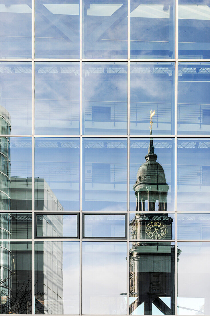 Reflection of St. Michael's Church in a glass facade, Hamburg, Germany