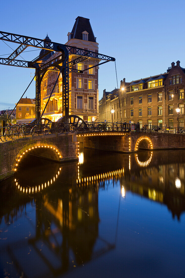 Doelen Hotel, Kloveniersburgwal in the evening, Amsterdam, Netherlands