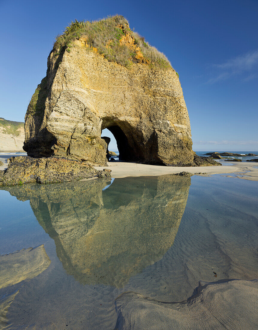 Rock arch on Wharariki Beach with hole, Tasman, South Island, New Zealand
