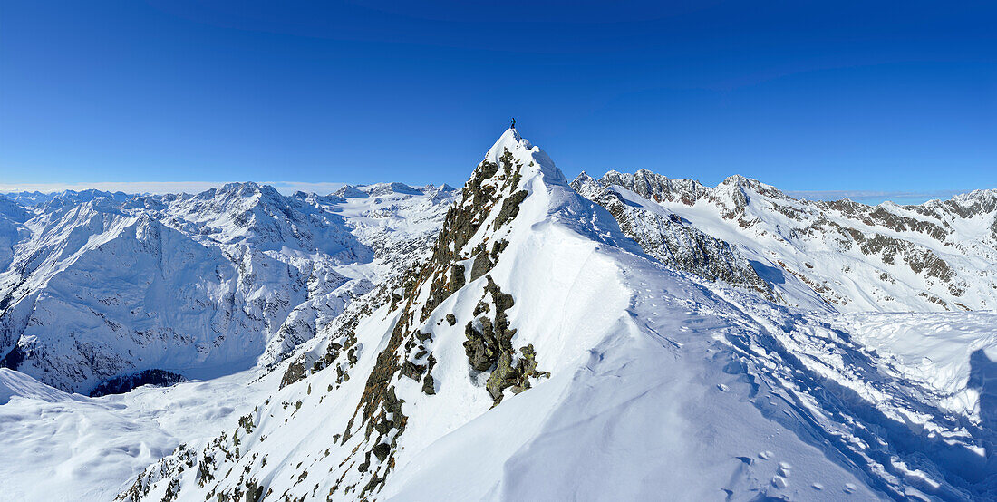 Woman standing on summit of Aeusseres Hocheck, Pflersch valley, Stubai Alps, South Tyrol, Italy