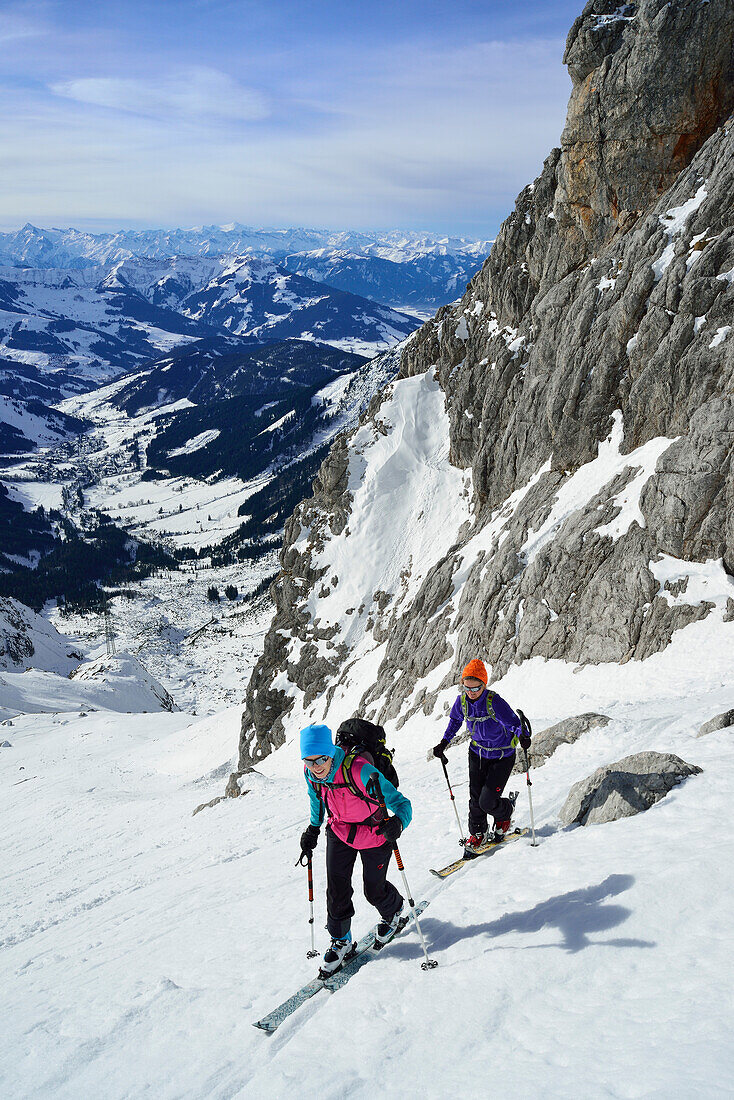 Two female back-country skiers ascending to Marterlkopf, Steinernes Meer, Berchtesgaden Alps, Salzburg, Austria