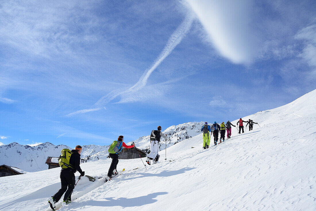 Back-country skiers ascending to Regenfeldjoch, Langer Grund, Kitzbuehel Alps, Tyrol, Austria