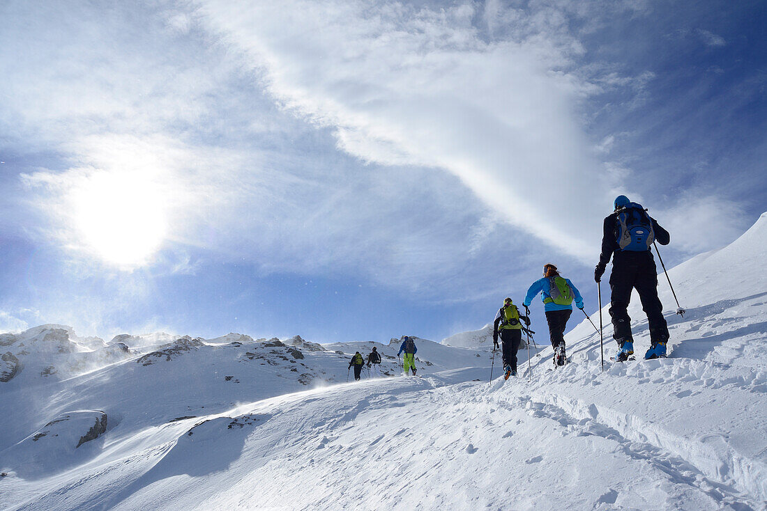 Back-country skiers ascending to Regenfeldjoch, Langer Grund, Kitzbuehel Alps, Tyrol, Austria