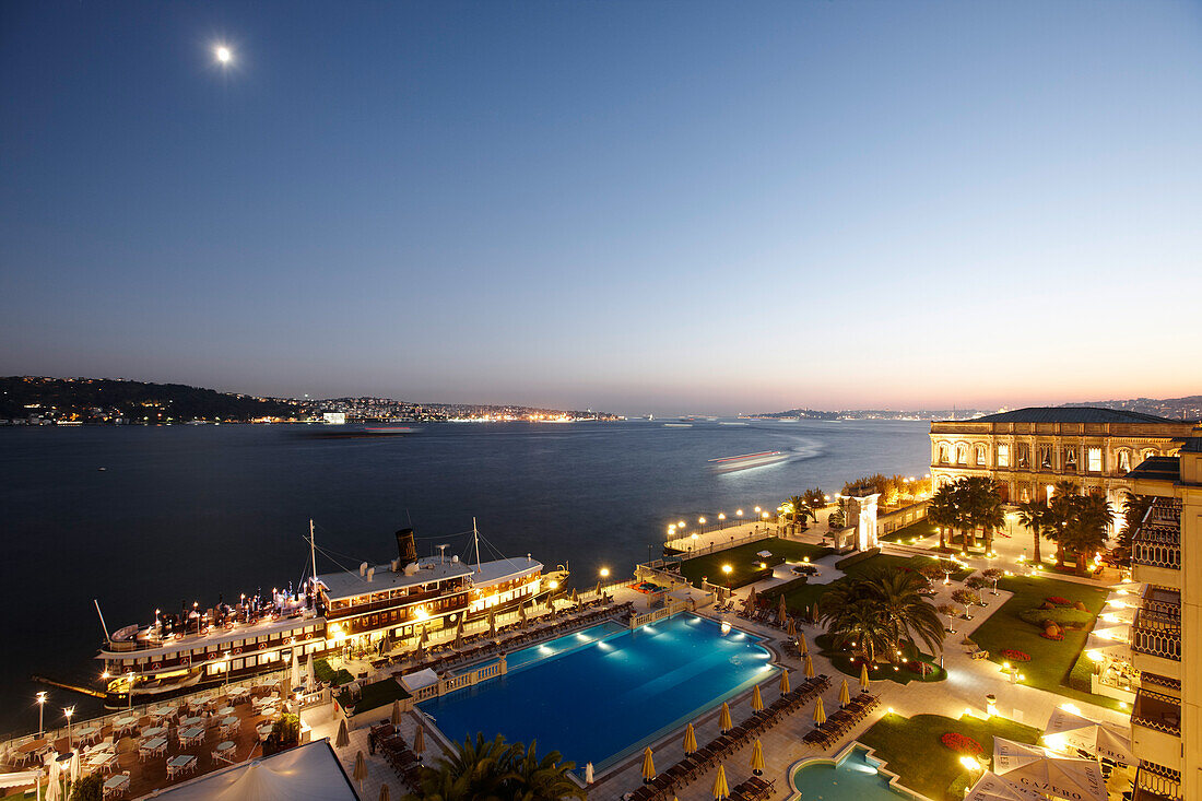Hotel complex with pool at the Bosphorus at night, Ciragan Palace, Istanbul, Turkey