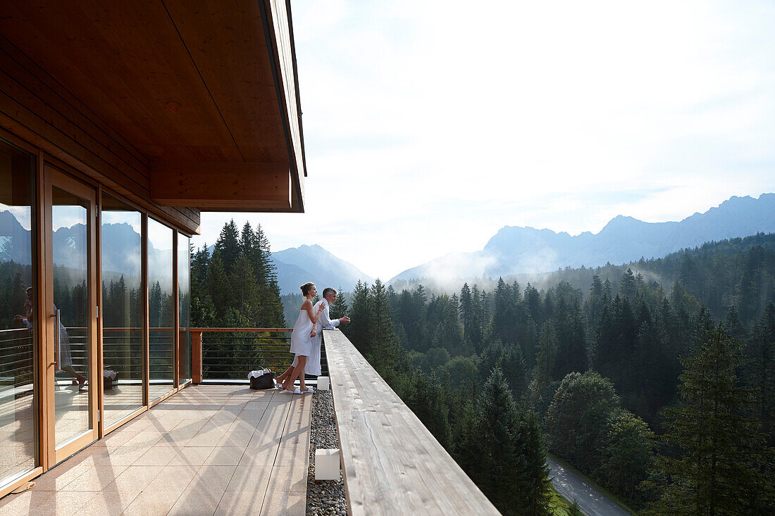 Couple on a balcony of a hotel sauna, Klais, Krun, Bavaria, Germany