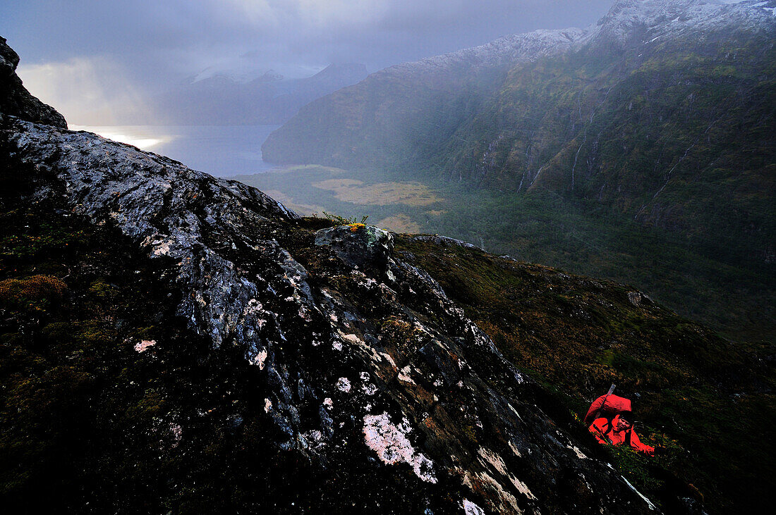 Mountaineer ascending to the base camp of Monte Sarmiento, Cordillera Darwin, Tierra del Fuego, Chile