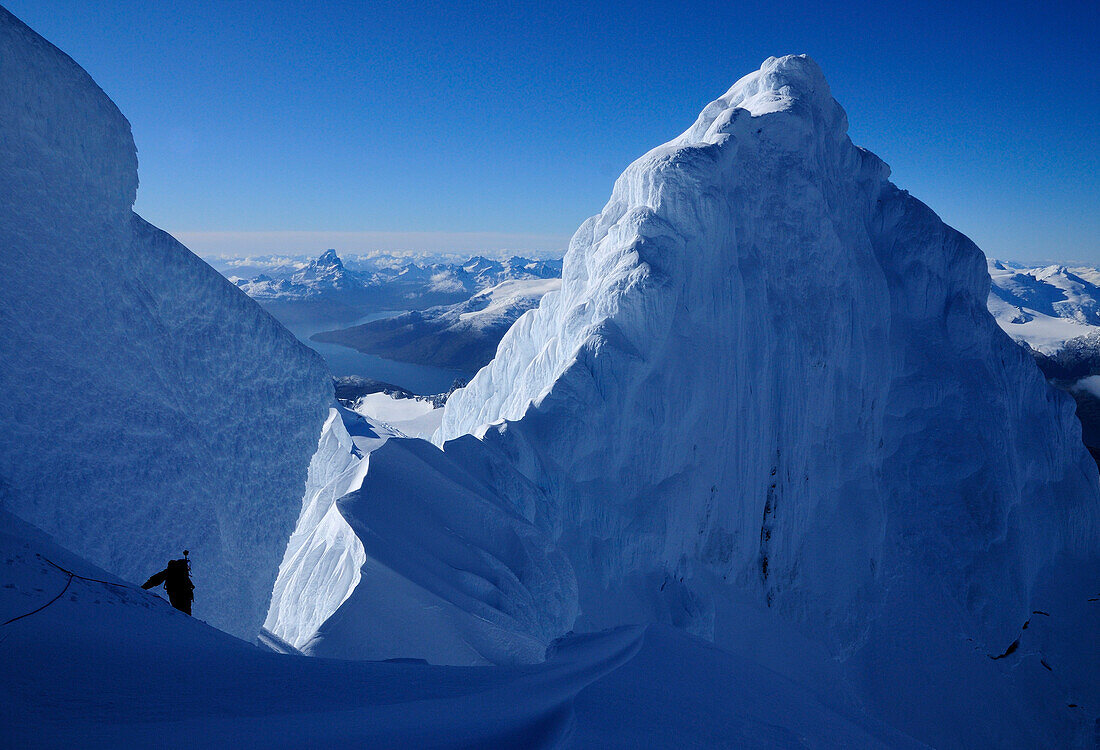 Mountaineer on the ridge between the two summits of Monte Sarmiento, Cordillera Darwin, Tierra del Fuego, Chile