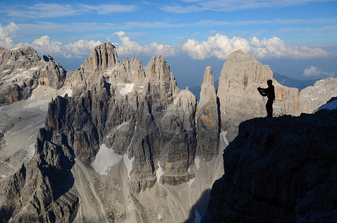 Climber on summit of Crozzon di Brenta, Brenta Dolomites, Trentino, Italy