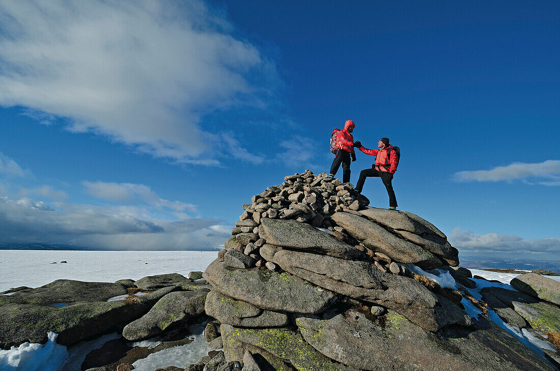 Two mountaineers on summit of Lochnagar, Cairngorms, Grampian Mountains, Highlands, Scotland, Great Britain