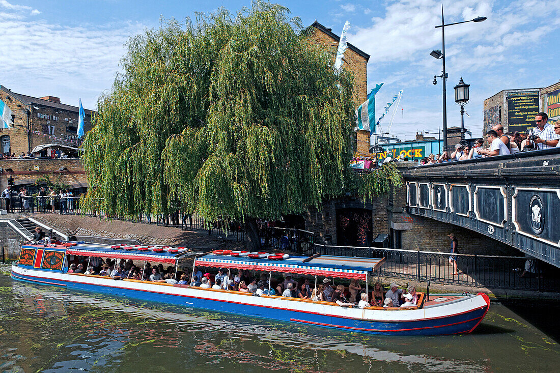 Long boat on Regent's Canal and Camden High Street and Camden Lock Market, Camden, London, England, United Kingdom