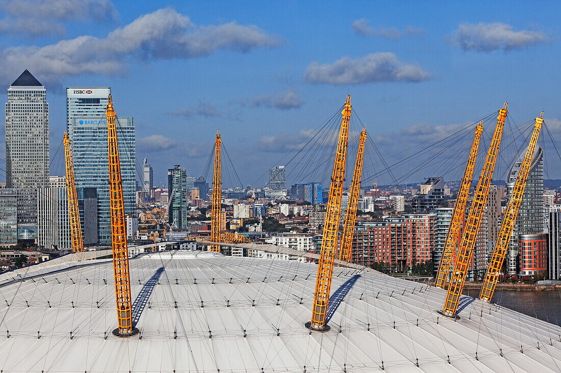 Millenium Dome and behind the skyline of the Isle of dogs and the City of London, seen from the Emirates Air Line, London, England, United Kingdom
