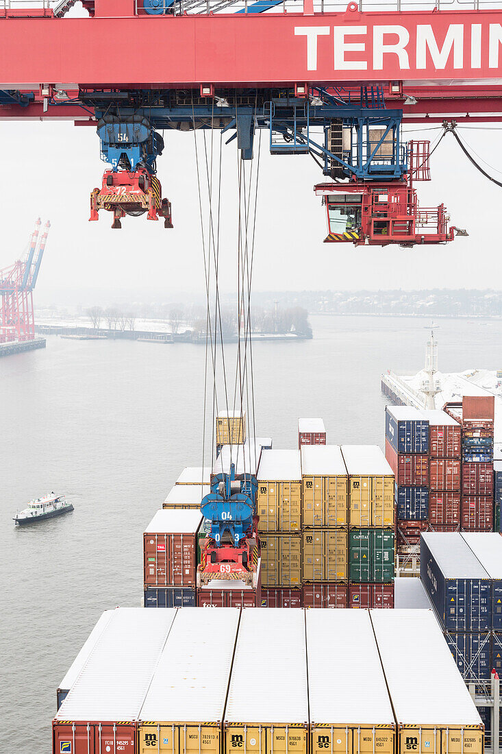 Loading and unloading of the container ship in the Container Terminal in Hamburg, Germany
